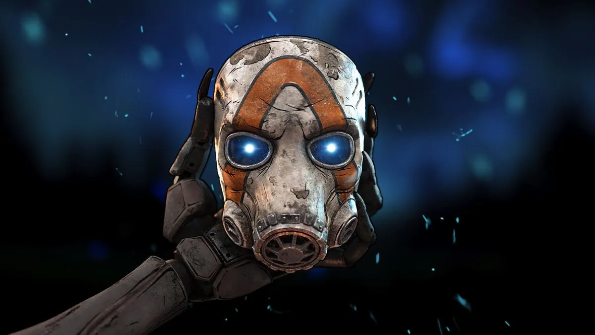 Standbild aus dem Videospiel Borderlands 4. Nahaufnahme einer Roboterhand, die eine ramponierte und schmutzige weiße Gesichtsmaske/Gasmaske hält. Die Maske hat einen dicken orangen Streifen, der von der Unterseite einer Wange über die Stirn bis zur Unterseite der anderen Wange verläuft. Die Augen reflektieren ein grelles blaues Licht.